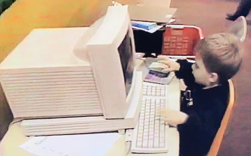 Anthony Custable as a child at a computer in the 1990s